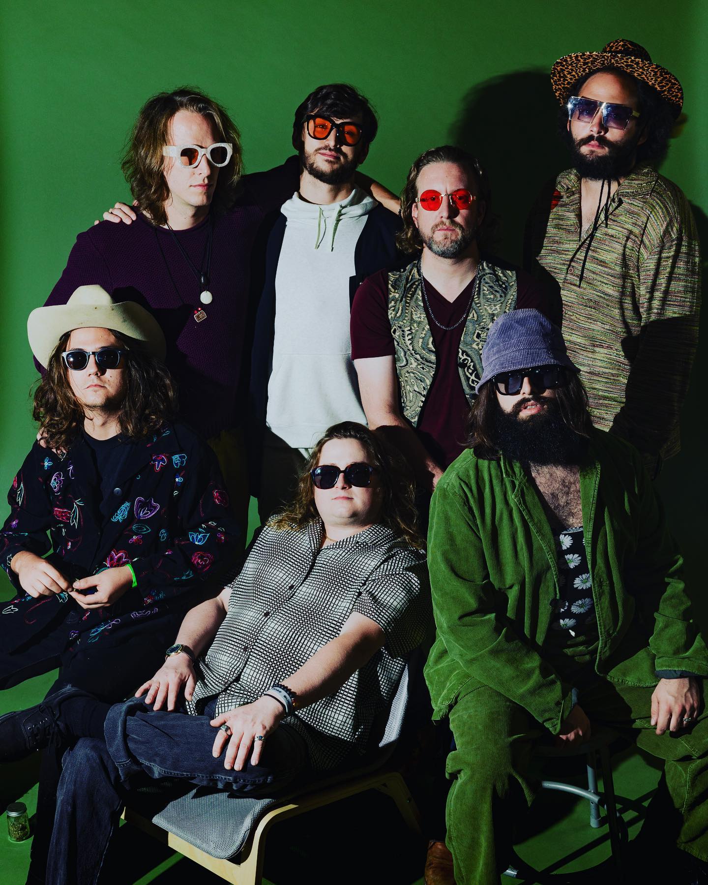 A seven-man band poses for a promotional photo.