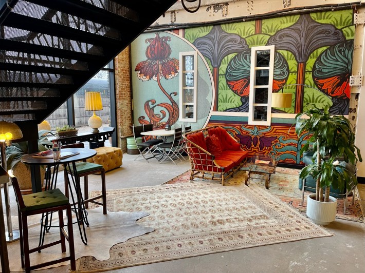 A sunlit, eclectically-designed room inside of WOMPA
