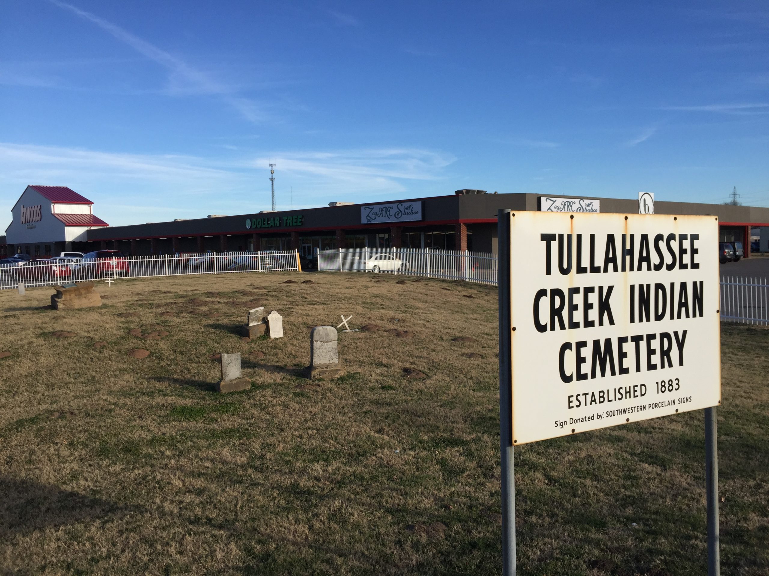 The Tullahasse Creek Indian Cemetery, surrounded by the Atwood's parking lot in Sand Springs, OK.